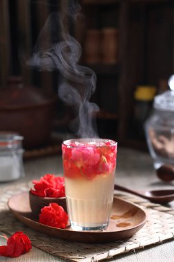 Coffee is a drink prepared from roasted coffee beans. Darkly colored, bitter, and slightly acidic, coffee has a stimulating effect on humans, primarily due to its caffeine content. It has the highest sales in the world market for hot drinks.