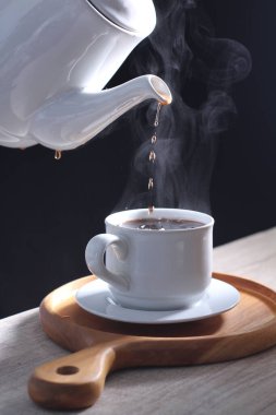 Coffee is a drink prepared from roasted coffee beans. Darkly colored, bitter, and slightly acidic, coffee has a stimulating effect on humans, primarily due to its caffeine content. It has the highest sales in the world market for hot drinks.