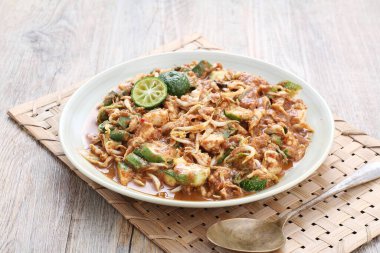 Karedok is a raw vegetable salad in peanut sauce from Sundanese region, West Java, Indonesia. It is one of the Sundanese signature dish.