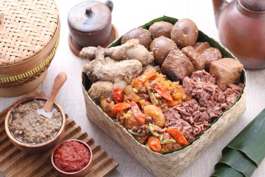 Gudeg is a traditional Javanese dish from Yogyakarta and Central Java, Indonesia. Gudeg is made from young unripe jack fruit (Javanese: gori, Indonesian: nangka muda) stewed for several hours with palm sugar, and coconut milk