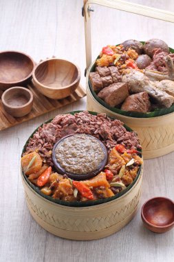 Gudeg is a traditional Javanese dish from Yogyakarta and Central Java, Indonesia. Gudeg is made from young unripe jack fruit (Javanese: gori, Indonesian: nangka muda) stewed for several hours with palm sugar, and coconut milk