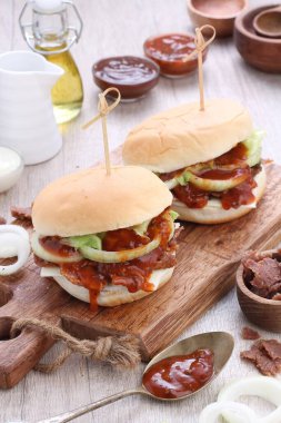 Burger or Burgers may refer to: Hamburger, a sandwich consisting of one or more cooked beef patties, placed inside a sliced bread roll or bun roll.