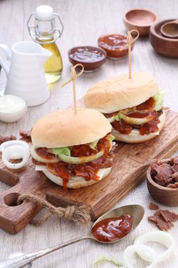 Burger or Burgers may refer to: Hamburger, a sandwich consisting of one or more cooked beef patties, placed inside a sliced bread roll or bun roll.