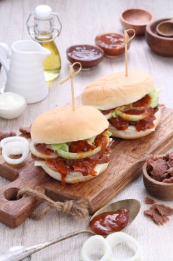 Burger or Burgers may refer to: Hamburger, a sandwich consisting of one or more cooked beef patties, placed inside a sliced bread roll or bun roll.