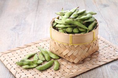 Edamame is Japanese dish and prepared of immature soybeans in the pod. The pods are boiled or steamed and may be served with salt or other condiments. Nowadays it became to be so popular in the world 
