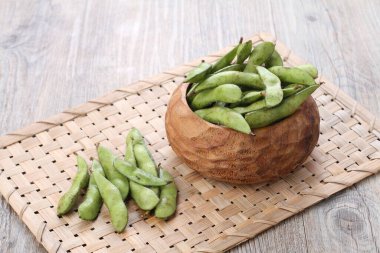 Edamame is Japanese dish and prepared of immature soybeans in the pod. The pods are boiled or steamed and may be served with salt or other condiments. Nowadays it became to be so popular in the world
