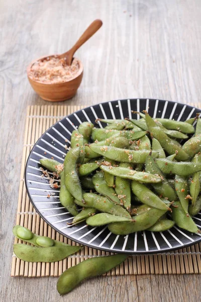 Edamame is Japanese dish and prepared of immature soybeans in the pod. The pods are boiled or steamed and may be served with salt or other condiments. Nowadays it became to be so popular in the world