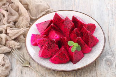 Dragon Fruit, also known as pitaya or pitahaya, is an exotic fruit grown from several different species of cactus indigenous to North, South, and Central America. 