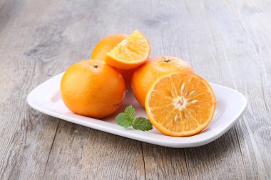An orange is a fruit of various citrus species in the family Rutaceae, it primarily refers to Citrus  sinensis, which is also called sweet orange, to distinguish it from the related Citrus  aurantium, referred to as bitter orange. 