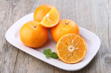 An orange is a fruit of various citrus species in the family Rutaceae, it primarily refers to Citrus  sinensis, which is also called sweet orange, to distinguish it from the related Citrus  aurantium, referred to as bitter orange. 