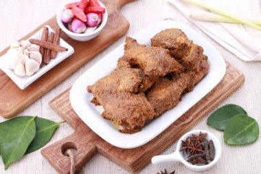 Rendang is a Minang dish originating from the Minangkabau region in West Sumatra, Indonesia. It has spread across Indonesian cuisine to the cuisines of neighbouring Southeast Asian countries such as Malaysia, Singapore, Brunei and the Philippines.