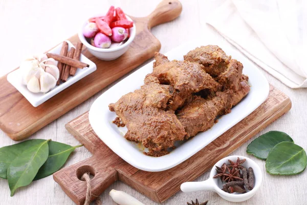 stock image Rendang is a Minang dish originating from the Minangkabau region in West Sumatra, Indonesia. It has spread across Indonesian cuisine to the cuisines of neighbouring Southeast Asian countries such as Malaysia, Singapore, Brunei and the Philippines.