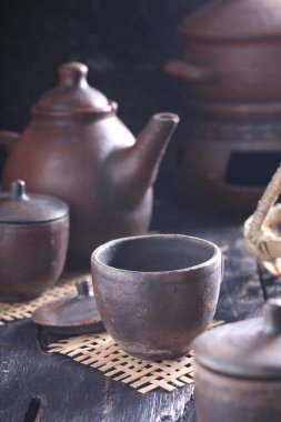 Tea is an aromatic beverage prepared by pouring hot or boiling water over cured or fresh leaves of Camellia sinensis, an evergreen shrub native to East Asia which probably originated in the borderlands of southwestern China and northern Myanmar. 