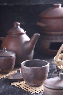 Tea is an aromatic beverage prepared by pouring hot or boiling water over cured or fresh leaves of Camellia sinensis, an evergreen shrub native to East Asia which probably originated in the borderlands of southwestern China and northern Myanmar. 