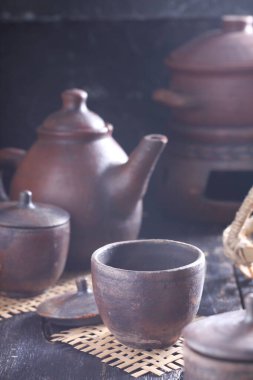 Tea is an aromatic beverage prepared by pouring hot or boiling water over cured or fresh leaves of Camellia sinensis, an evergreen shrub native to East Asia which probably originated in the borderlands of southwestern China and northern Myanmar. 