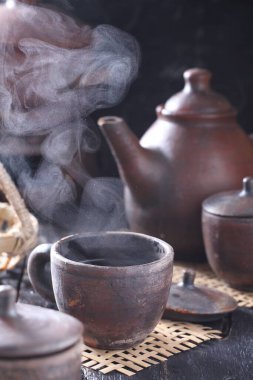 Tea is an aromatic beverage prepared by pouring hot or boiling water over cured or fresh leaves of Camellia sinensis, an evergreen shrub native to East Asia which probably originated in the borderlands of southwestern China and northern Myanmar. 