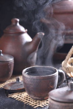 Tea is an aromatic beverage prepared by pouring hot or boiling water over cured or fresh leaves of Camellia sinensis, an evergreen shrub native to East Asia which probably originated in the borderlands of southwestern China and northern Myanmar. 