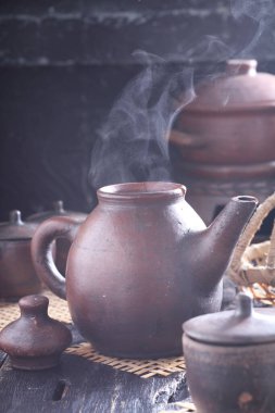 Tea is an aromatic beverage prepared by pouring hot or boiling water over cured or fresh leaves of Camellia sinensis, an evergreen shrub native to East Asia which probably originated in the borderlands of southwestern China and northern Myanmar. 