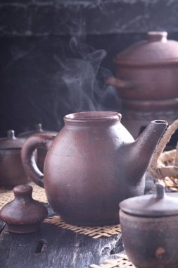Tea is an aromatic beverage prepared by pouring hot or boiling water over cured or fresh leaves of Camellia sinensis, an evergreen shrub native to East Asia which probably originated in the borderlands of southwestern China and northern Myanmar. 