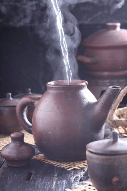 Tea is an aromatic beverage prepared by pouring hot or boiling water over cured or fresh leaves of Camellia sinensis, an evergreen shrub native to East Asia which probably originated in the borderlands of southwestern China and northern Myanmar. 