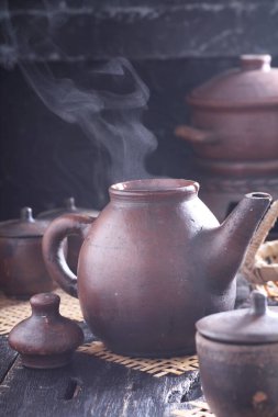 Tea is an aromatic beverage prepared by pouring hot or boiling water over cured or fresh leaves of Camellia sinensis, an evergreen shrub native to East Asia which probably originated in the borderlands of southwestern China and northern Myanmar. 