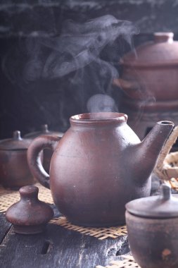 Tea is an aromatic beverage prepared by pouring hot or boiling water over cured or fresh leaves of Camellia sinensis, an evergreen shrub native to East Asia which probably originated in the borderlands of southwestern China and northern Myanmar. 