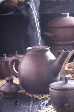 Tea is an aromatic beverage prepared by pouring hot or boiling water over cured or fresh leaves of Camellia sinensis, an evergreen shrub native to East Asia which probably originated in the borderlands of southwestern China and northern Myanmar. 