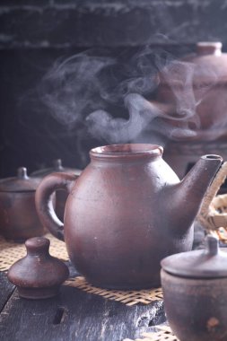 Tea is an aromatic beverage prepared by pouring hot or boiling water over cured or fresh leaves of Camellia sinensis, an evergreen shrub native to East Asia which probably originated in the borderlands of southwestern China and northern Myanmar. 