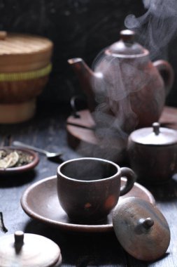 Tea is an aromatic beverage prepared by pouring hot or boiling water over cured or fresh leaves of Camellia sinensis, an evergreen shrub native to East Asia which probably originated in the borderlands of southwestern China and northern Myanmar. 