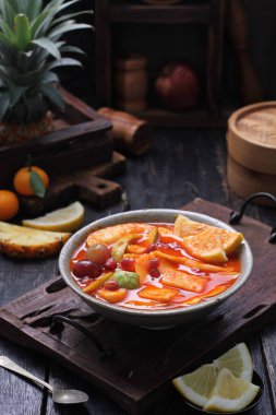 Asinan is a pickled vegetable or fruit dish, commonly found in Indonesia. Asin, Indonesian for 