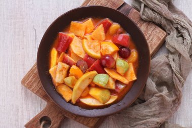 Asinan is a pickled vegetable or fruit dish, commonly found in Indonesia. Asin, Indonesian for 