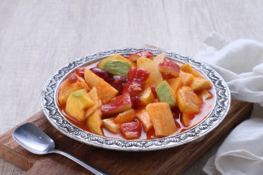 Asinan is a pickled vegetable or fruit dish, commonly found in Indonesia. Asin, Indonesian for 