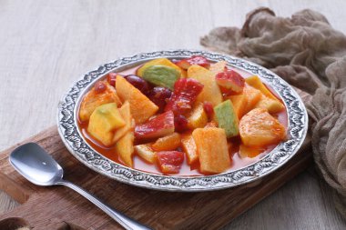 Asinan is a pickled vegetable or fruit dish, commonly found in Indonesia. Asin, Indonesian for 