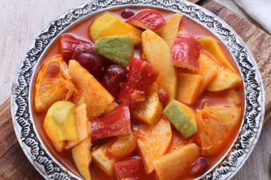 Asinan is a pickled vegetable or fruit dish, commonly found in Indonesia. Asin, Indonesian for 