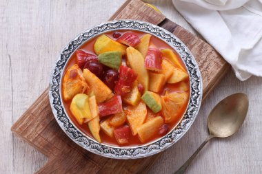 Asinan is a pickled vegetable or fruit dish, commonly found in Indonesia. Asin, Indonesian for 