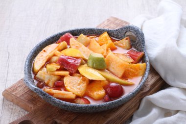 Asinan is a pickled vegetable or fruit dish, commonly found in Indonesia. Asin, Indonesian for 