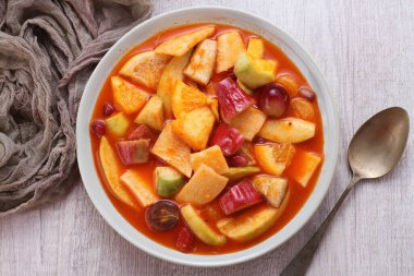 Asinan is a pickled vegetable or fruit dish, commonly found in Indonesia. Asin, Indonesian for 