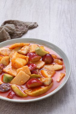 Asinan is a pickled vegetable or fruit dish, commonly found in Indonesia. Asin, Indonesian for 