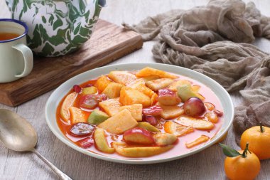 Asinan is a pickled vegetable or fruit dish, commonly found in Indonesia. Asin, Indonesian for 