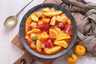 Asinan is a pickled vegetable or fruit dish, commonly found in Indonesia. Asin, Indonesian for 