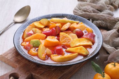 Asinan is a pickled vegetable or fruit dish, commonly found in Indonesia. Asin, Indonesian for 