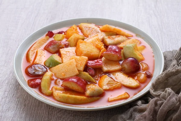 Asinan is a pickled vegetable or fruit dish, commonly found in Indonesia. Asin, Indonesian for 