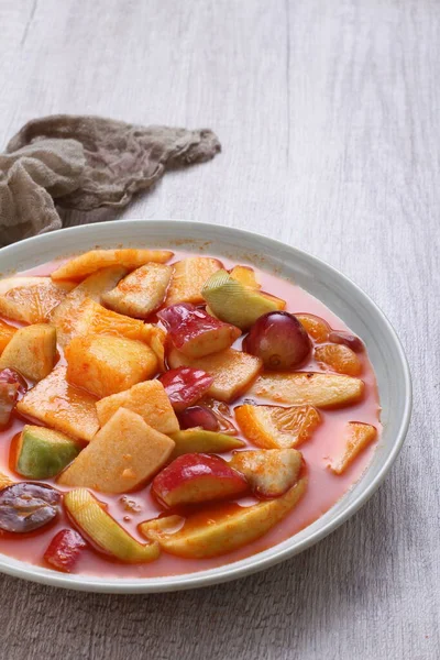 Asinan is a pickled vegetable or fruit dish, commonly found in Indonesia. Asin, Indonesian for 