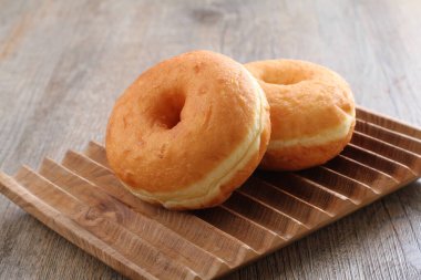 Donuts are fried confectionery, made from wheat flour batter, granulated sugar, egg yolks, baker's yeast, and butter. 