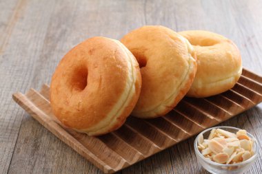 Donuts are fried confectionery, made from wheat flour batter, granulated sugar, egg yolks, baker's yeast, and butter. 