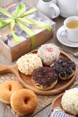 Donuts are fried confectionery, made from wheat flour batter, granulated sugar, egg yolks, baker's yeast, and butter. 