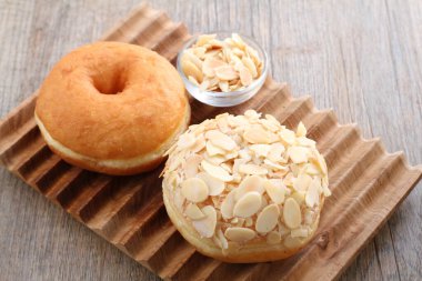 Donuts are fried confectionery, made from wheat flour batter, granulated sugar, egg yolks, baker's yeast, and butter
