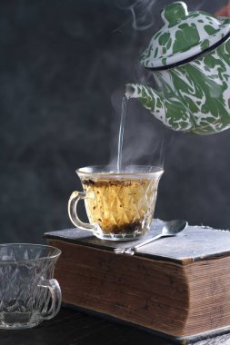 Tea is an aromatic beverage prepared by pouring hot or boiling water over cured or fresh leaves of Camellia sinensis, an evergreen shrub native to East Asia which probably originated in the borderlands of southwestern China and northern Myanmar.