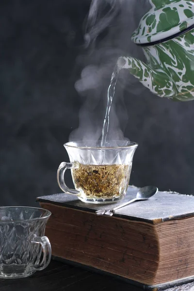Tea is an aromatic beverage prepared by pouring hot or boiling water over cured or fresh leaves of Camellia sinensis, an evergreen shrub native to East Asia which probably originated in the borderlands of southwestern China and northern Myanmar.