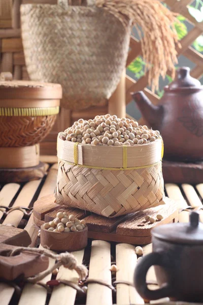 stock image buckwheat in a wicker basket on a wooden background